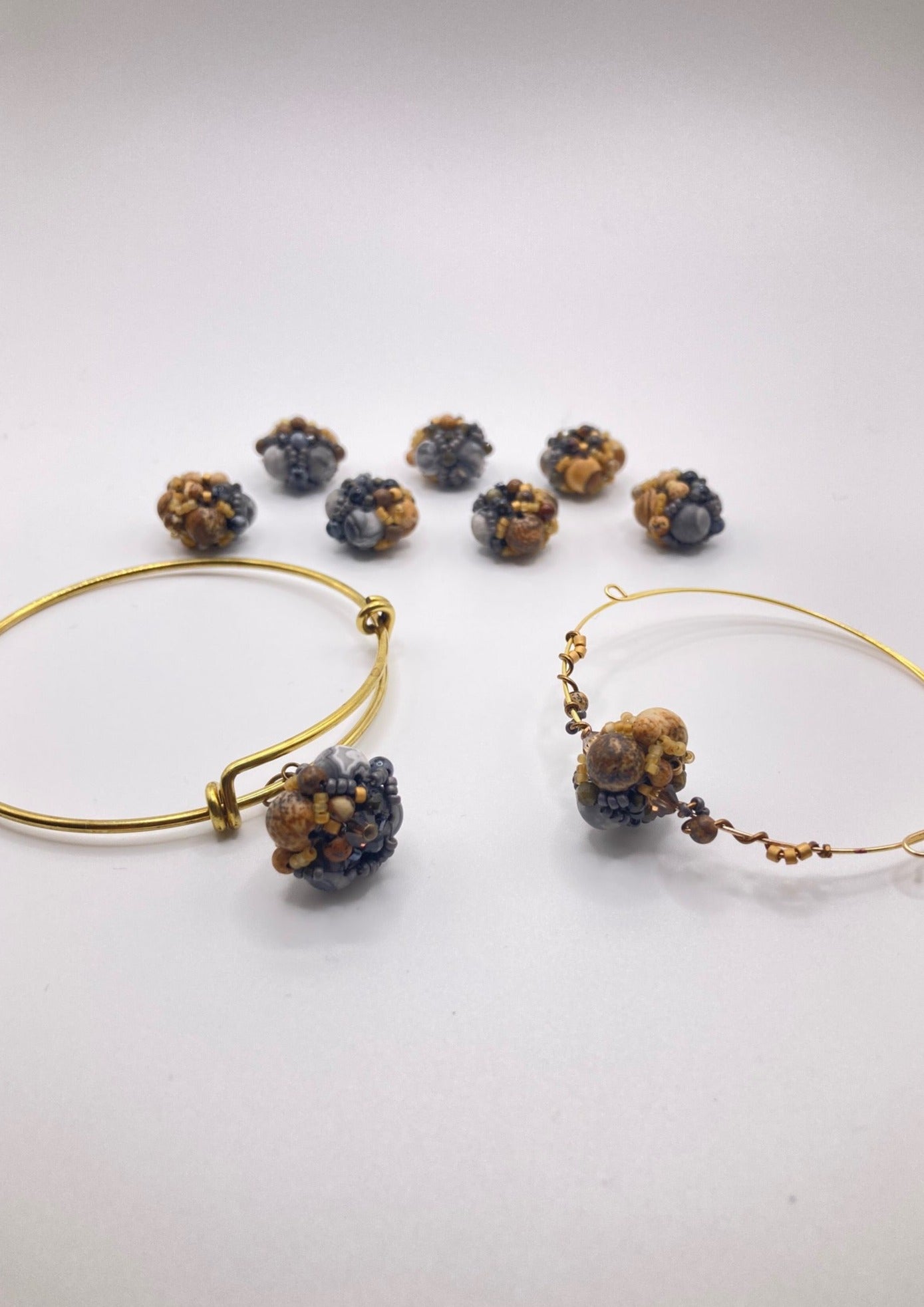 Inspired by the glacial potholes of Shelburne Falls, MA. Beautifully hand sewn beaded bracelet made with gray jasper, pyrite, hematite, picture jasper, golden obsidian and tiger's eye semi-precious stones. Perfect gift for those who are nature-inspired.