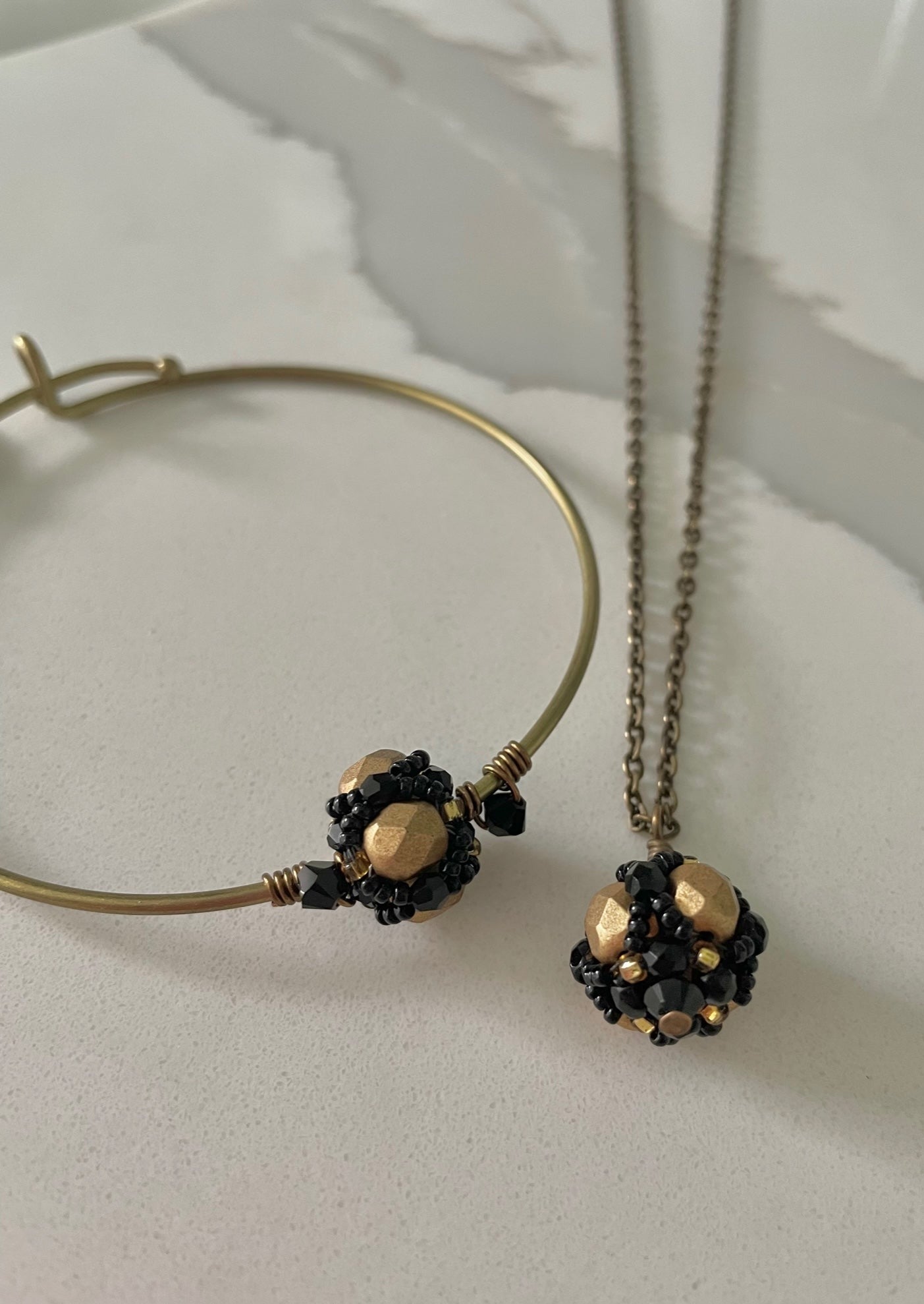 Black and Gold Hand beaded Tigress Bangle Bracelet and necklace by Mango Fish Inc.