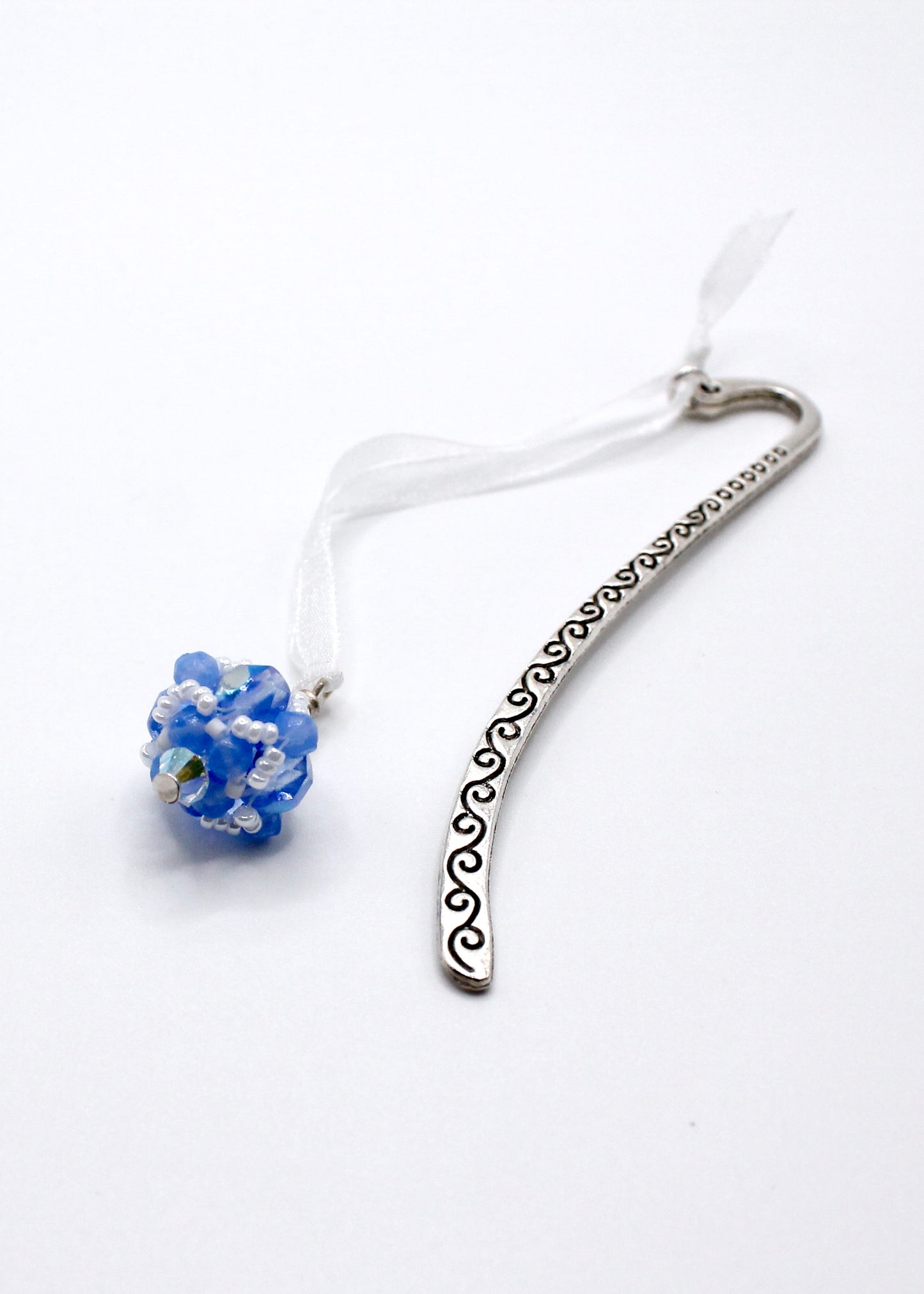 Light blue hand sewn beaded bookmark makes the perfect gift for a teacher and educator. Light blue is the official academic program color for education.
