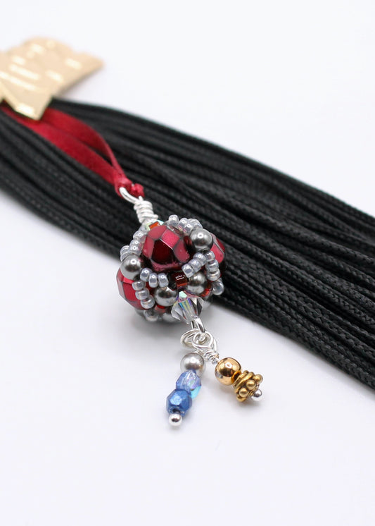Hand sewn beaded pendant attaches to a graduation tassel charm using the official Pantone colors of Indiana Univesity of PA, crimson and slate gray.